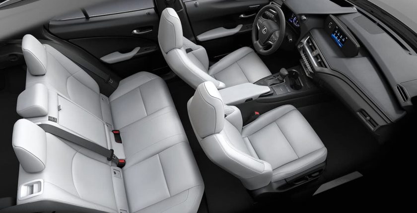 A car with white leather seats and black trim.