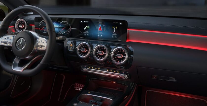 A car dashboard with the center console turned on.