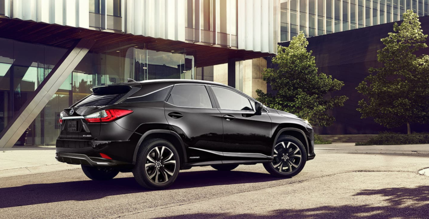 A black lexus rx 3 5 0 parked on the side of a road.