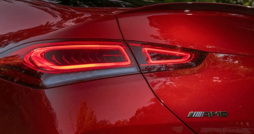 A close up of the rear lights on a red car