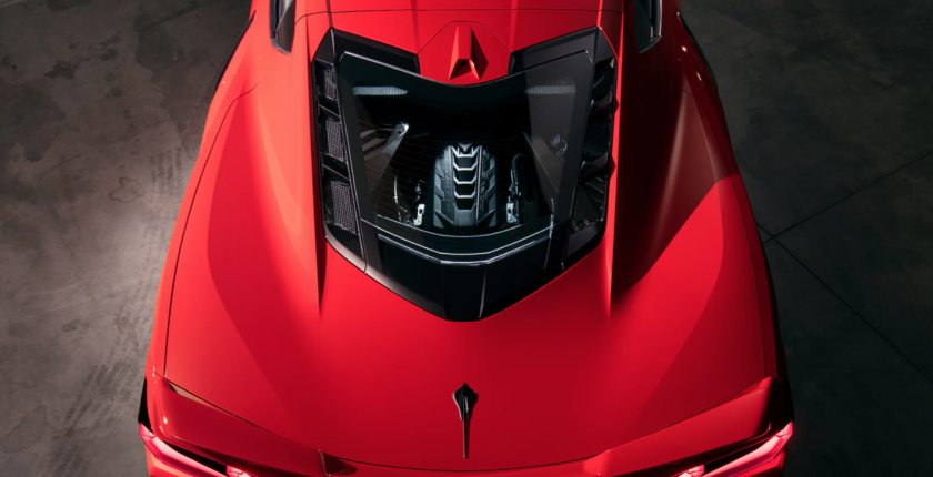 A close up of the hood on a red car
