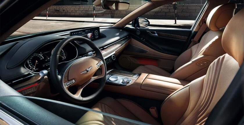 A car with brown leather seats and steering wheel.