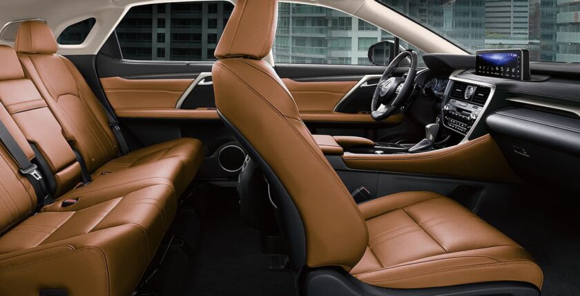 A car with brown leather seats and black trim.