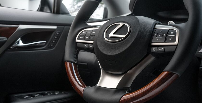 A close up of the steering wheel in a car