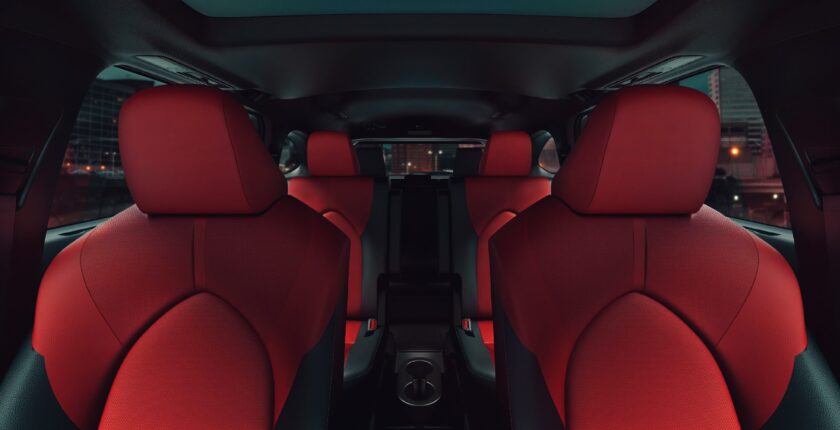A red car with the seats folded down.