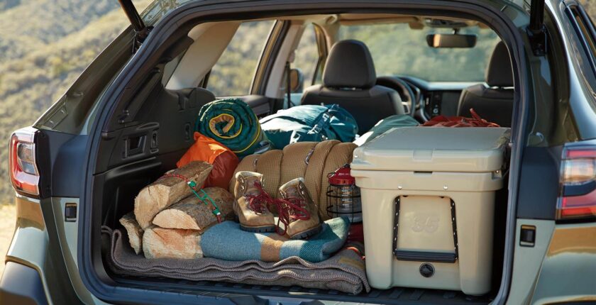 A car trunk filled with lots of items and supplies.