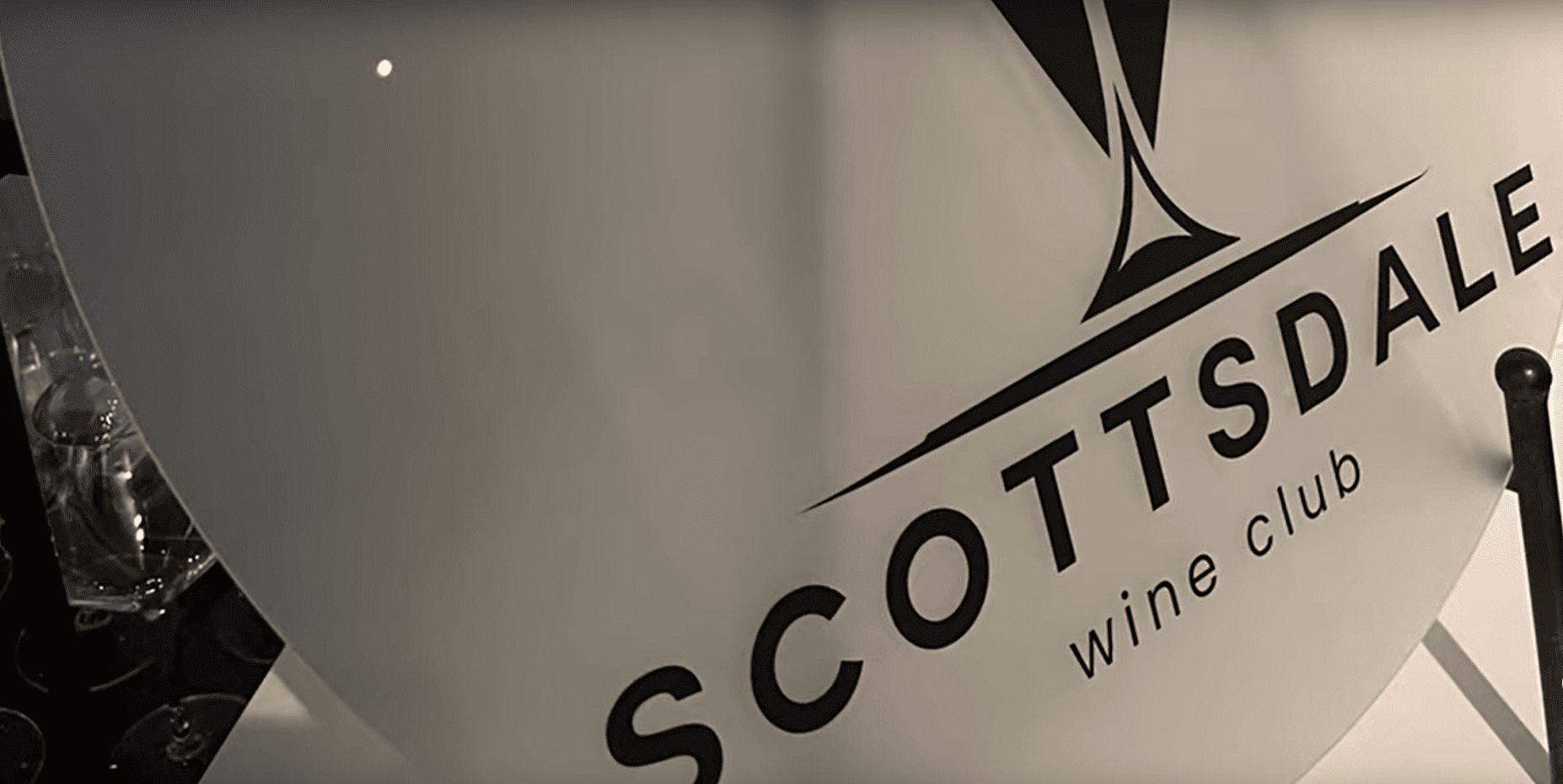 A close up of the scotts wine company logo.