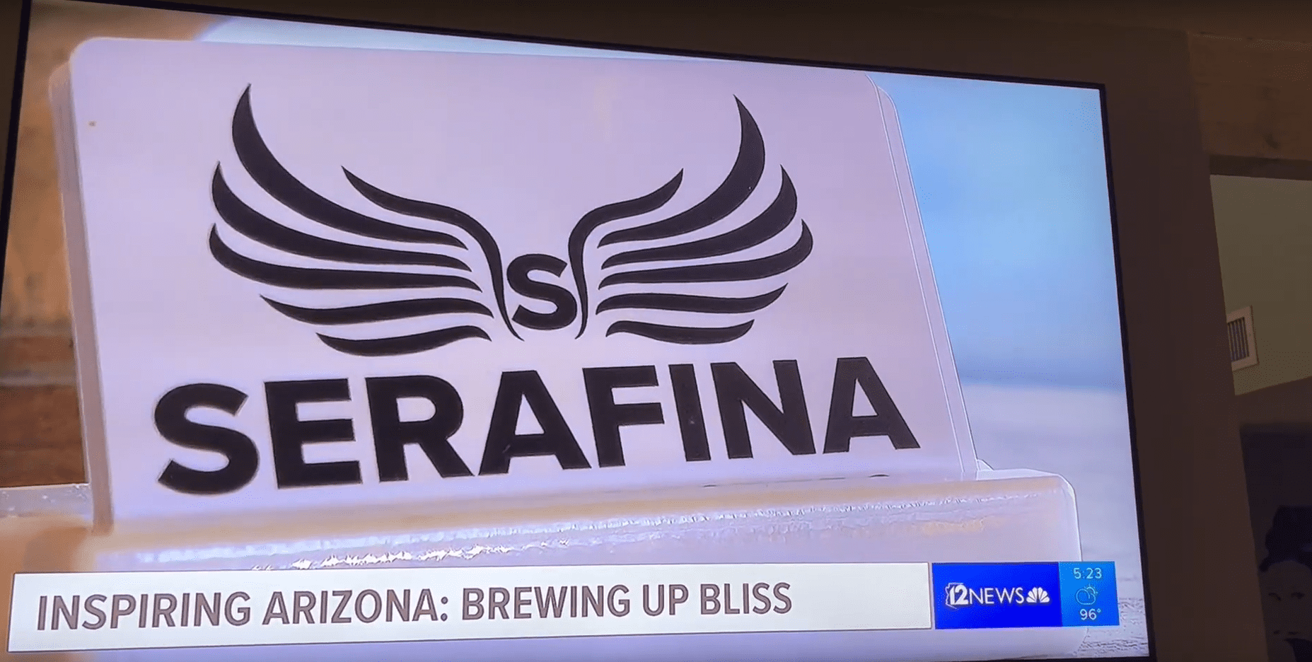 A close up of the logo for serafina