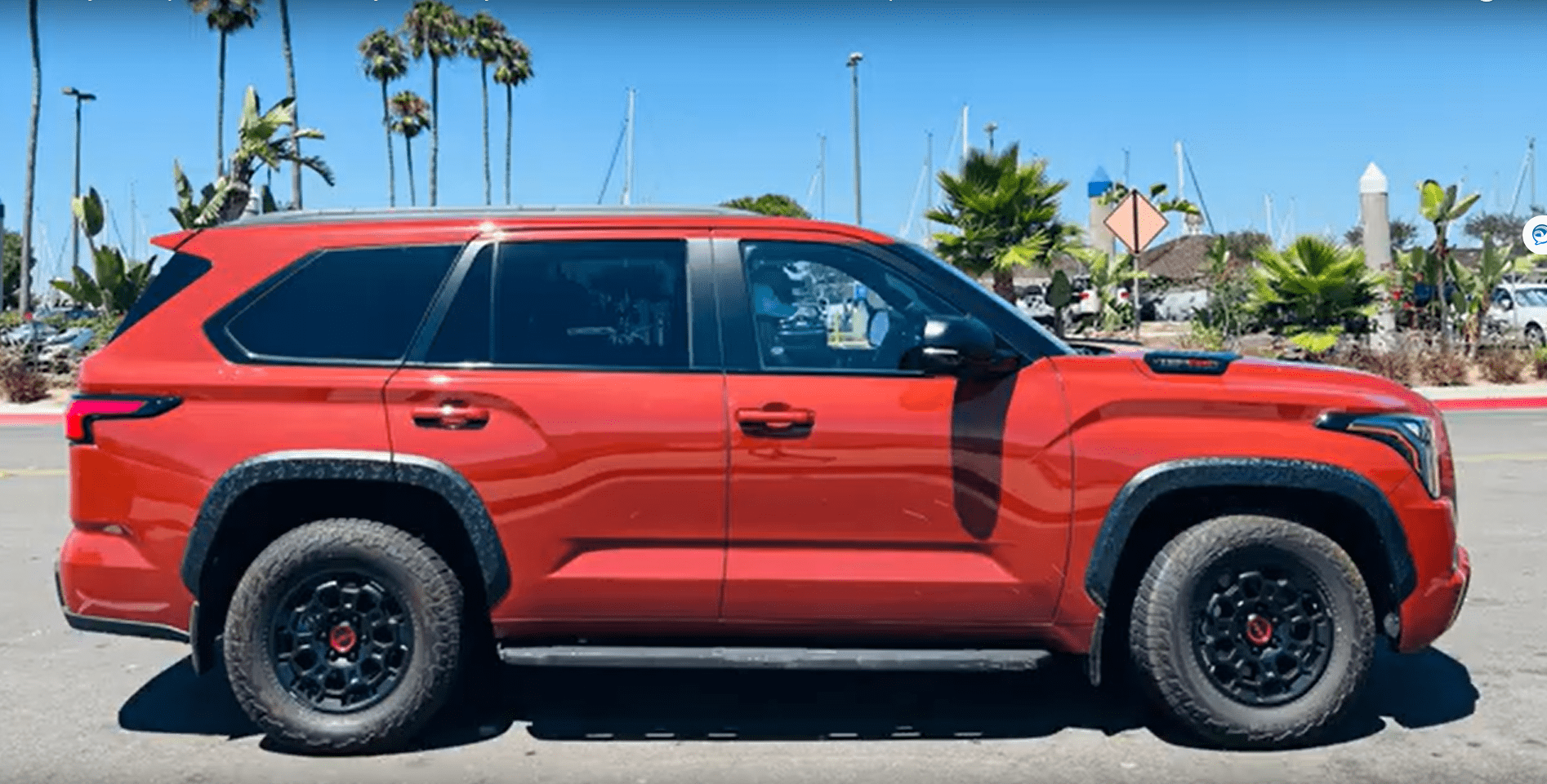 A red suv parked in the parking lot.